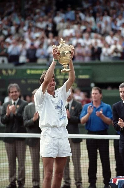 Mens Wimbledon Final. Michael Stich v Boris Becker Stich lifts the trophy