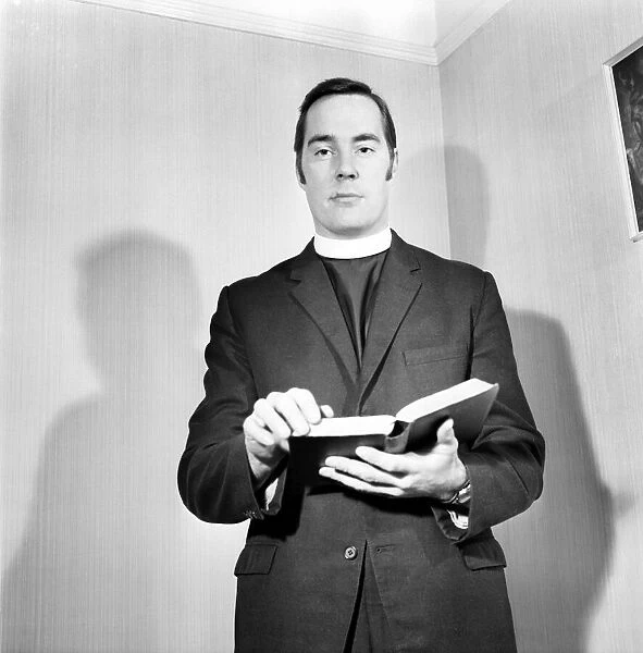 A Methodist minister reading from the Bible. November 1969 Z10935-004