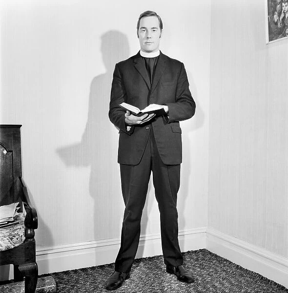 A Methodist minister reading from the Bible. November 1969 Z10935-006