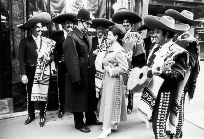 Framed Print : Mexican singer Maria de Lourdes tries her charms on a London policeman to no avail
