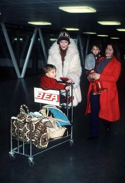 Mia Farrow actress at airport with children MSI