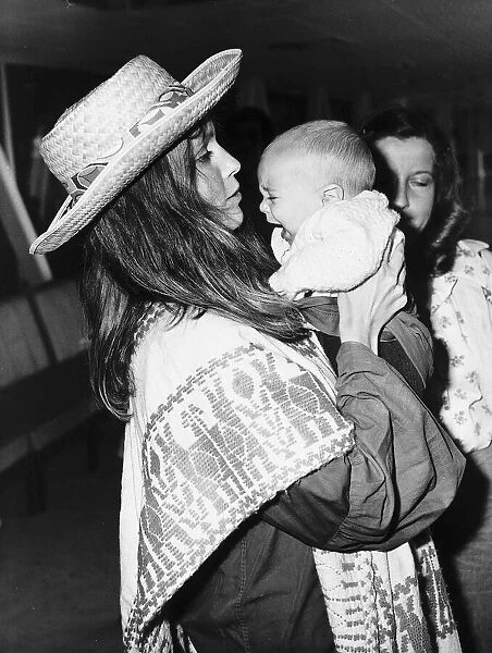 Mia Farrow Actress comforts Baby Fletcher - July 1974 Dbase MSI
