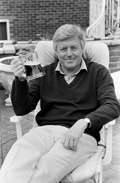 Michael Aspel relaxes at home. 31st May 1988