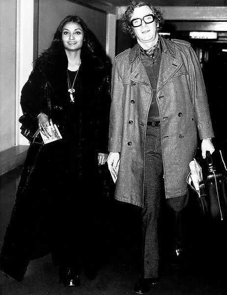 Michael Caine actor with wife Shakira at airport - December 1972 Dbase MSI