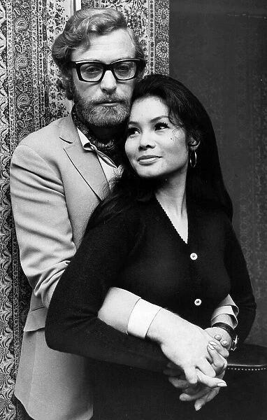 Michael Caine with his arms around girlfriend Minda November 1969