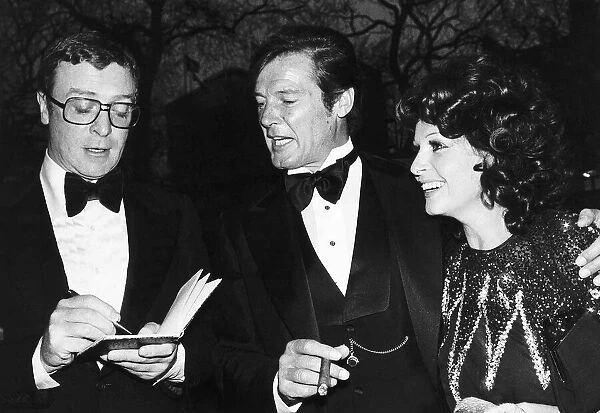 Michael Caine and Roger Moore with third wife Luisa At film premiere Shout at