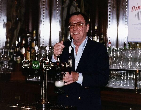 Michael Caine serving behind a bar