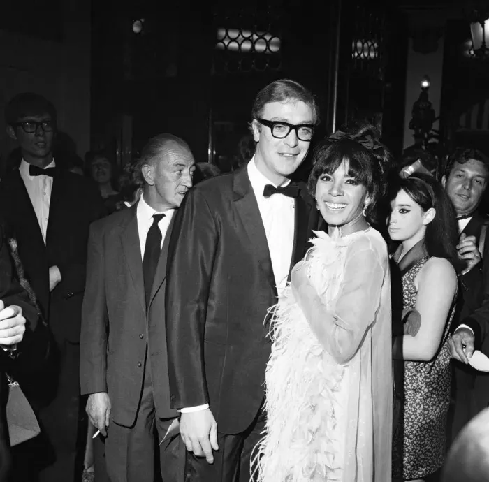 Framed Print : Michael Caine with Shirley Bassey at the premiere of the film Hurry Sundown at the Plaza