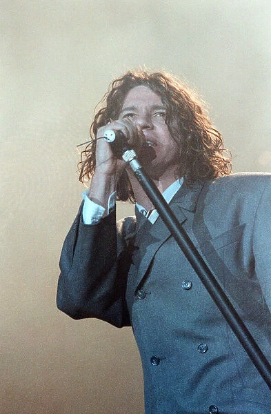 Michael Hutchence lead singer of INXS, pictured in concert - X Factor World Tour - at