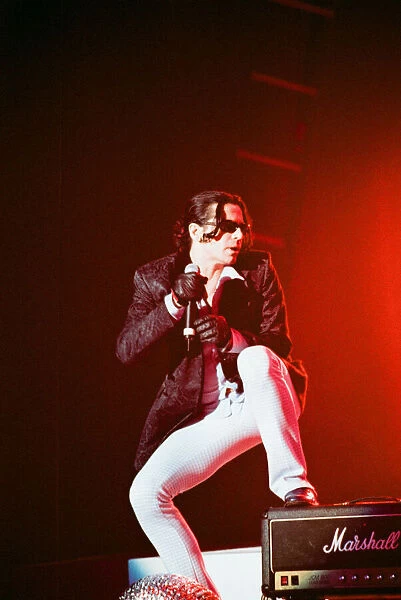 Michael Hutchence lead singer of INXS, pictured in concert - Elegantly Wasted World Tour