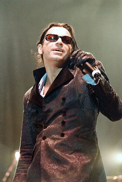 Michael Hutchence lead singer of INXS, pictured in concert - Elegantly Wasted World Tour