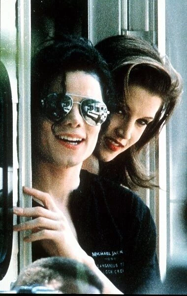 Michael Jackson pop Singer wearing dark glasses With Lisa Marie Presley