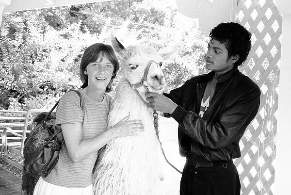 Michael Jackson seen here with Louie the llama at his California home. September 1983