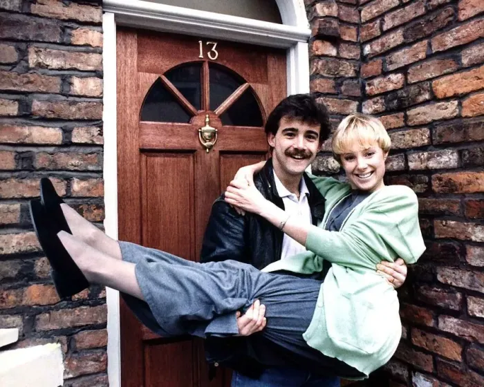 Framed Print : Michael Levell with Sally Whittacker outside their street home February 1988 Framed Print : Michael Levell with Sally Whittacker outside their street home February 1988