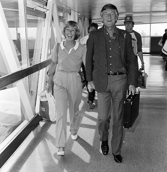 Michael Parkinson arrives at Heathrow with his wife Mary