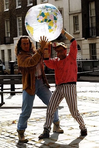 Michael Van Wijk Entertainer Holding model of world with Timmy Mallet on street Dbase