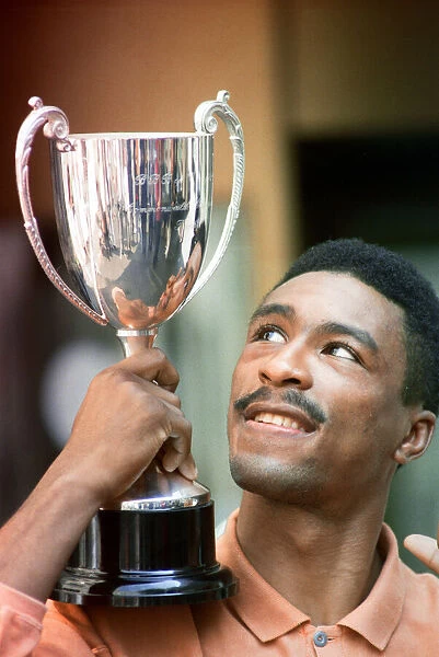 Michael Watson with the British Commonwealth middleweight trophy after defeating Nigel