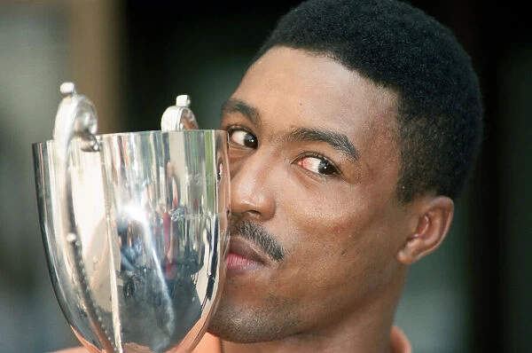 Michael Watson with the British Commonwealth middleweight trophy after defeating Nigel