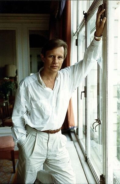 Michael York actor standing next to window - August 1989