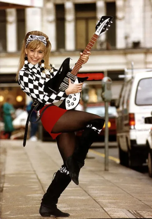 Framed Print : Michaela Strachan Childrens TV Presenter playing John Lennons Original Electric Guitar Framed Print : Michaela Strachan Childrens TV Presenter playing John Lennons Original Electric Guitar