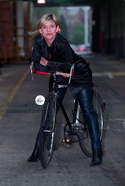 Michelle Collins Actress December 1997 Who stars in Eastenders sitting on bike