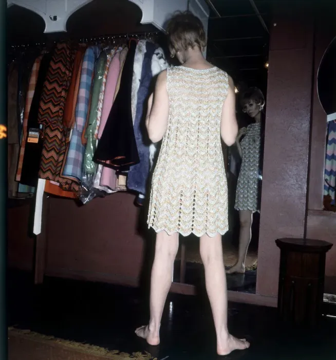 Framed Print : Michelle Desange tries on a chain mail dress while shopping in the Lady Jane Boutique