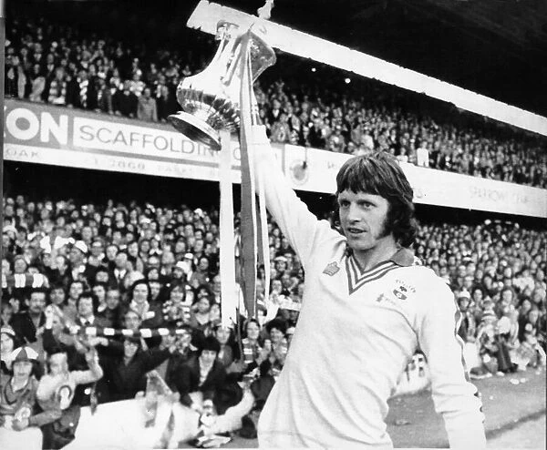 Mick Channon Footballer for Southampton. shows off the trophy to fans after their win in