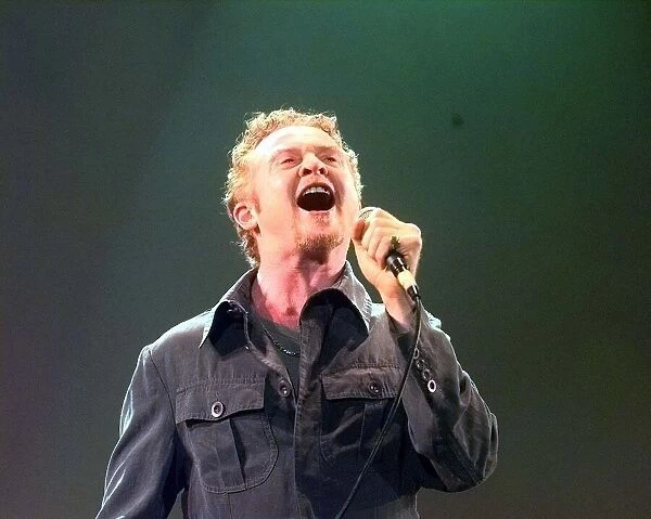 Mick Hucknall of Simply Red performing at Warwick Castle. August 1999