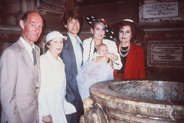 Mick Jagger with Jerry Hall and family at the Christening of Baby Daughter Elizabeth