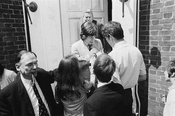 Mick Jagger, lead singer of the Rolling Stones pop group is surrounded by autograph