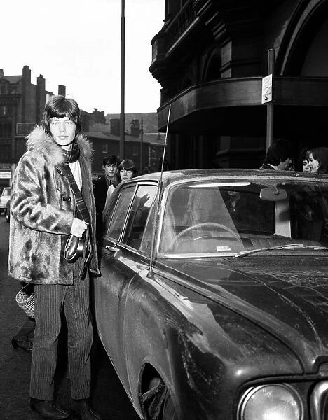 Mick Jagger of The Rolling Stones about to get into his car after filming ITVs