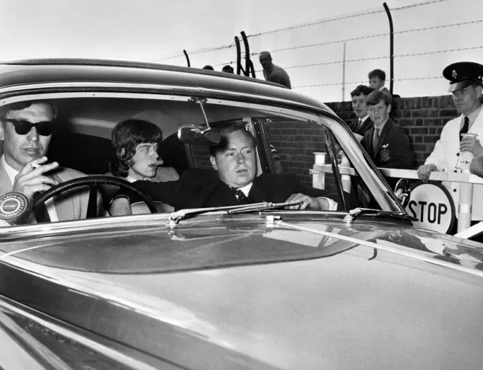 Framed Print : Mick Jagger of the Rolling Stones leaves brixton jail driving along the private road Framed Print : Mick Jagger of the Rolling Stones leaves brixton jail driving along the private road