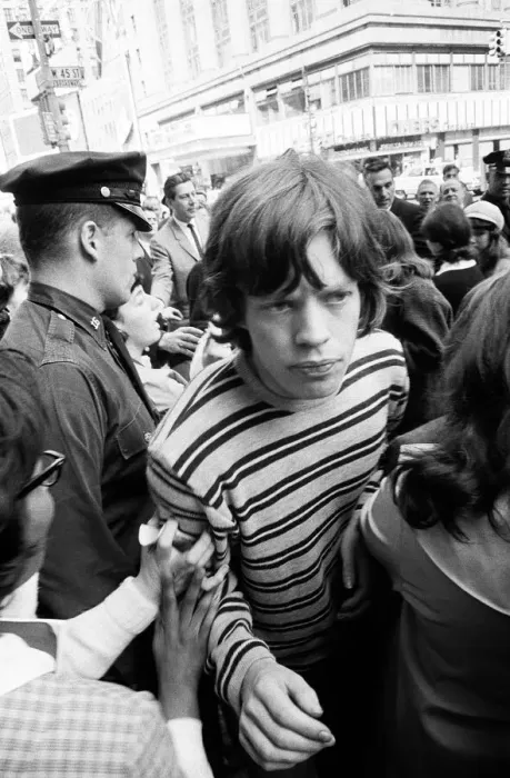 Framed Print : Mick Jagger of The Rolling Stones surrounded by fans on Broadway. 2nd June 1964
