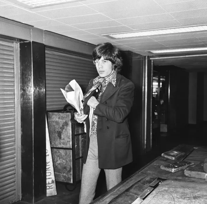 Framed Print : Mick Jagger seen here passing through passport control at London Airport as he flies of Framed Print : Mick Jagger seen here passing through passport control at London Airport as he flies of
