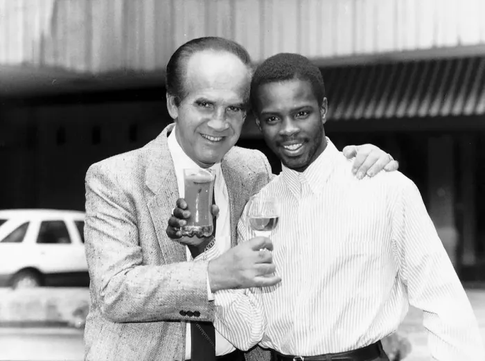 Framed Print : Mickey Duff Boxing Manager and Promoter drinks a toast with one of his Boxers Duke