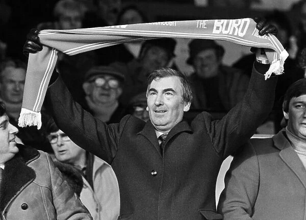 Middlesbrough FC chairman Alf Duffield, holding a club scarf high over his head