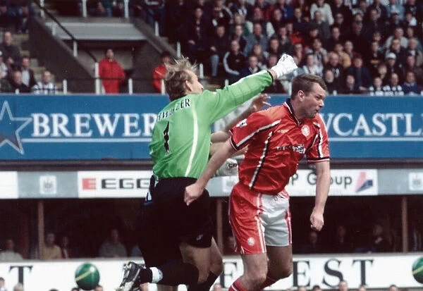 Middlesbrough keeper Mark Schwarzer knocks out team mate Gary Pallister while clearing a