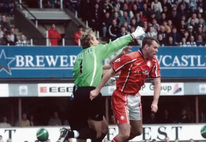 Framed Print : Middlesbrough keeper Mark Schwarzer knocks out team mate Gary Pallister while clearing a