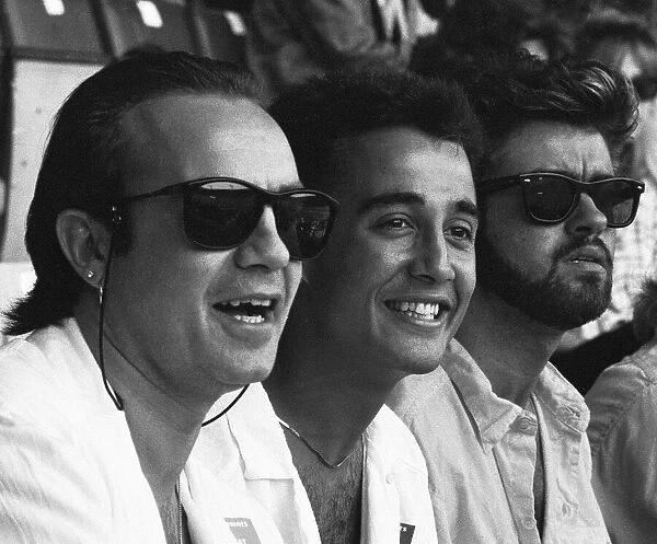 Midge Ure, Andrew Ridgeley and George Michael in the audience during the opening of