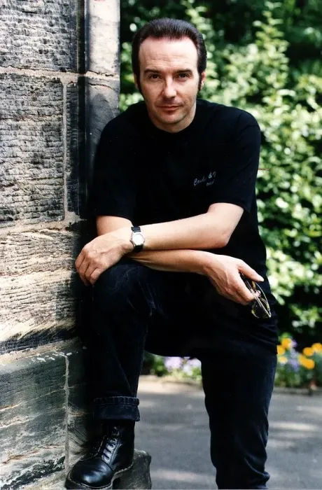 Framed Print : Midge Ure pop singer foot up arms on knee outside house black jeans T shirt Framed Print : Midge Ure pop singer foot up arms on knee outside house black jeans T shirt