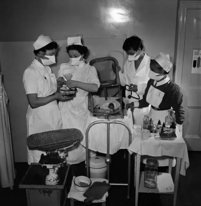 Framed Print : Midwives help delivery a two pound baby which was placed in an incubator. May 1953 D2623 Framed Print : Midwives help delivery a two pound baby which was placed in an incubator. May 1953 D2623