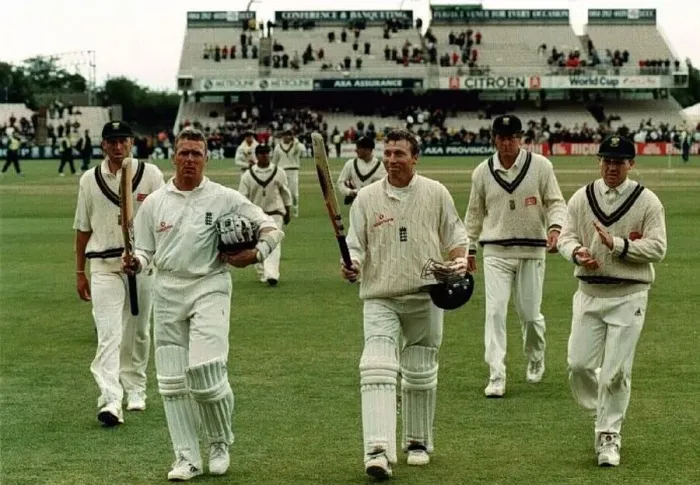  : Mike Atherton and Alec Stewart leave the field July 1998 after putting on over two