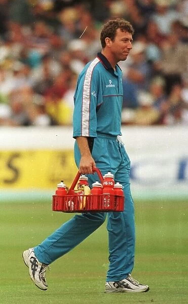 Mike Atherton of England and Lancashire August 1998 carries the drinks holder