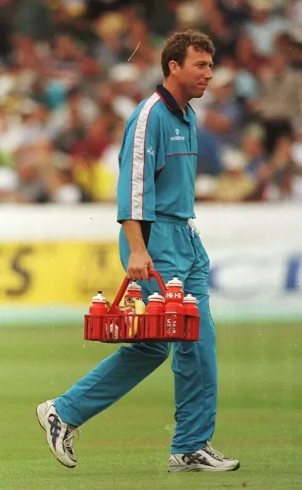 Framed Print : Mike Atherton of England and Lancashire August 1998 carries the drinks holder Framed Print : Mike Atherton of England and Lancashire August 1998 carries the drinks holder