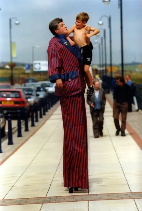 Framed Print : Mike Bridge with Dean Kennedy, 7, on stilts helps relaunch historic Seaham promenade