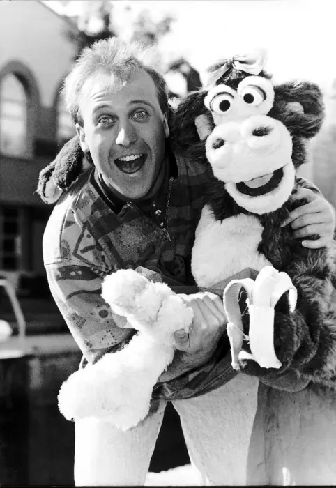 Framed Print : Mike Brosnan TV presenter with Chuck the Chimpanzee Framed Print : Mike Brosnan TV presenter with Chuck the Chimpanzee