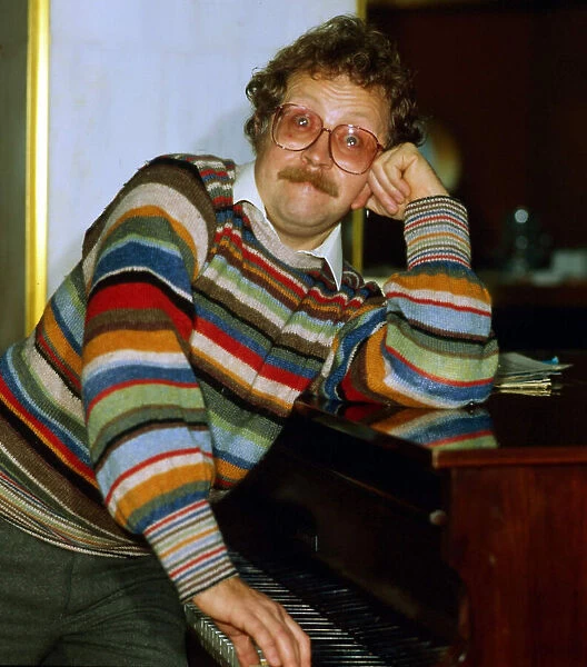 Mike Harding British comedian at piano November 1984