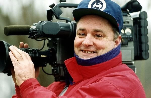 Mike Lloyd photographer holding video camera