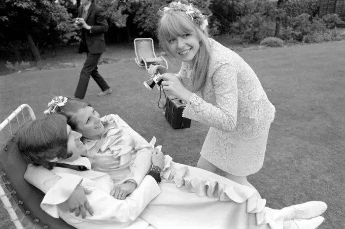 Framed Print : Mike McCartneys Wedding. Jane Asher takes a photograph of the bride Framed Print : Mike McCartneys Wedding. Jane Asher takes a photograph of the bride