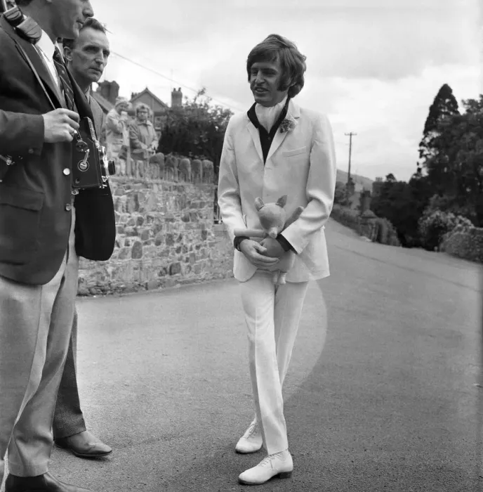 Framed Print : Mike McCartneys Wedding. Mike McGear with his doll on his way to church